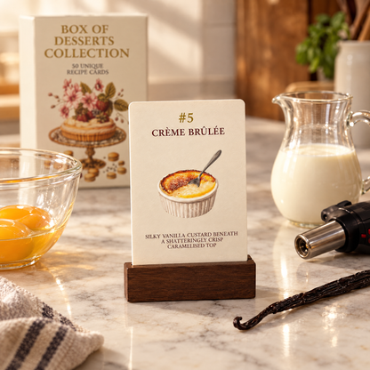 Recipe card #5 Crème Brûlée in a wooden stand next to baking ingredients